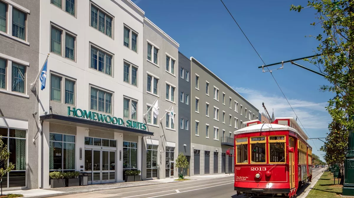 Homewood Suites by Hilton, with a streetcar passing out front on Rampart Street